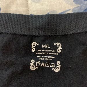 Black tights with button accents on ankle. Size M/L